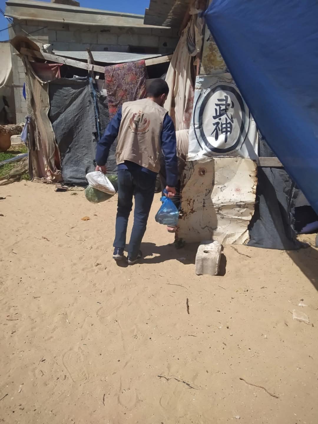 Volunteers constructing temporary shelters for displaced families